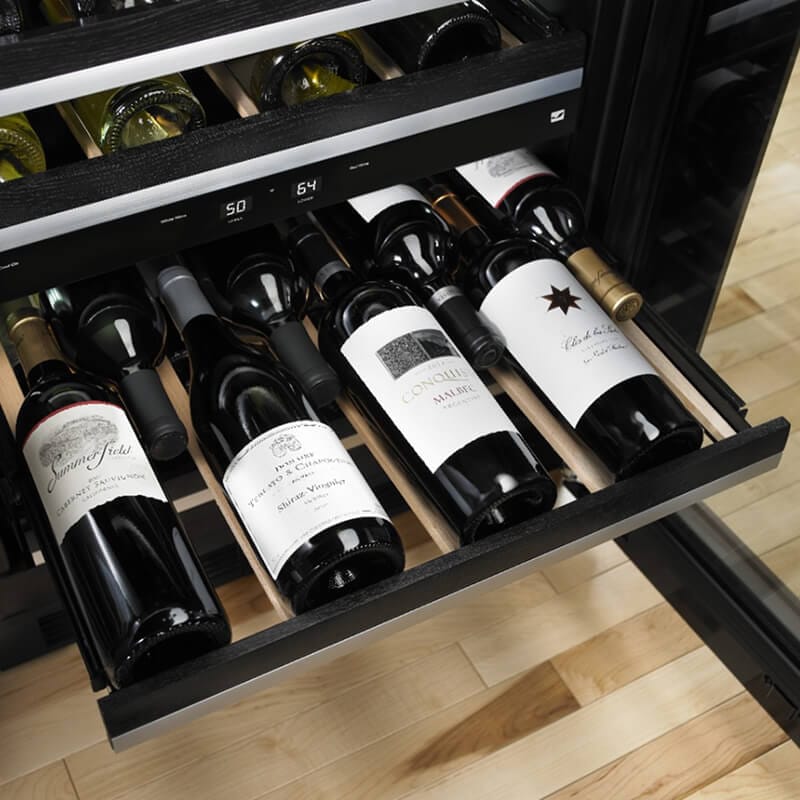 Interior of a JennAir® Undercounter Wine Refrigerator filled with wine bottles.