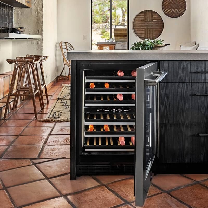 A compact home bar with an undercounter wine refrigerator.