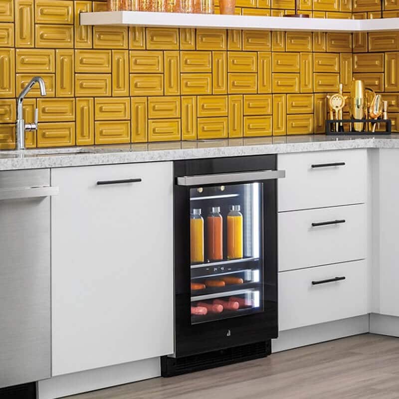 A modern home bar with an undercounter ice maker