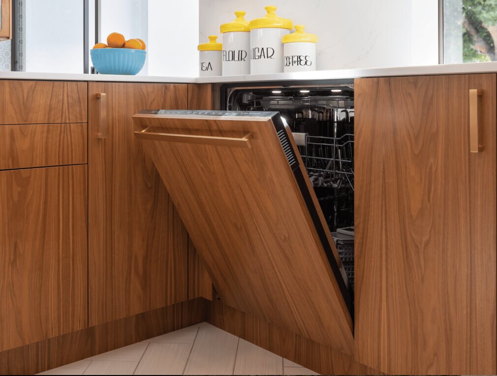 A panel-ready dishwasher blends in seamlessly in an upscale luxury kitchen.