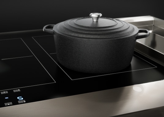 Cast-iron cookware on an induction stovetop.