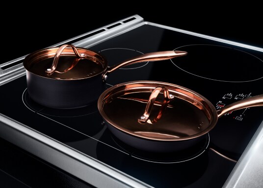 Induction cookware placed on top of an induction cooktop with flexible cooking zones.