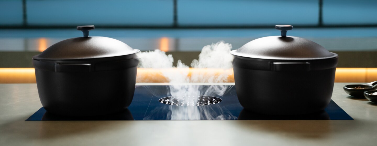 Induction-compatible cookware on a luxury induction cooktop.