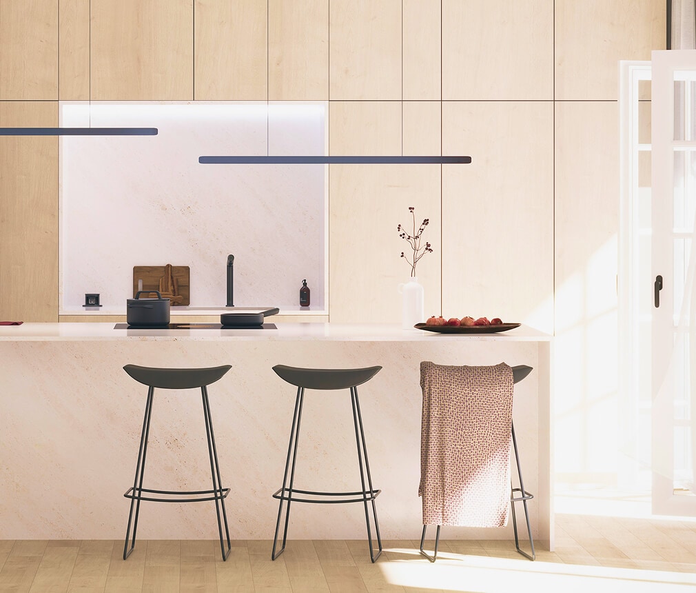 Stools in front of a kitchen island.