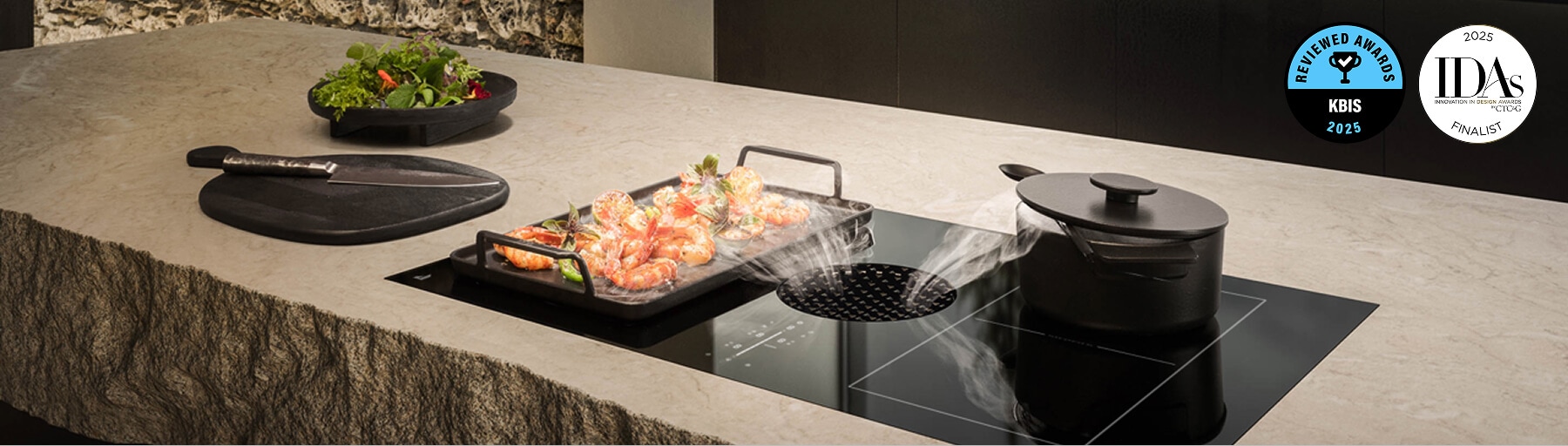 Two dishes with steam cooking on a JennAir® Induction Downdraft Cooktop.