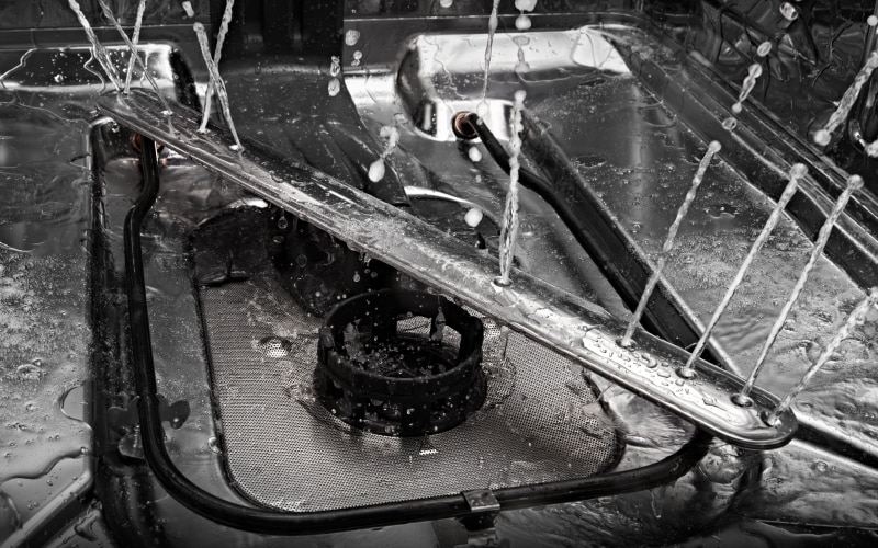 The water arm inside a JennAir Dishwasher. 