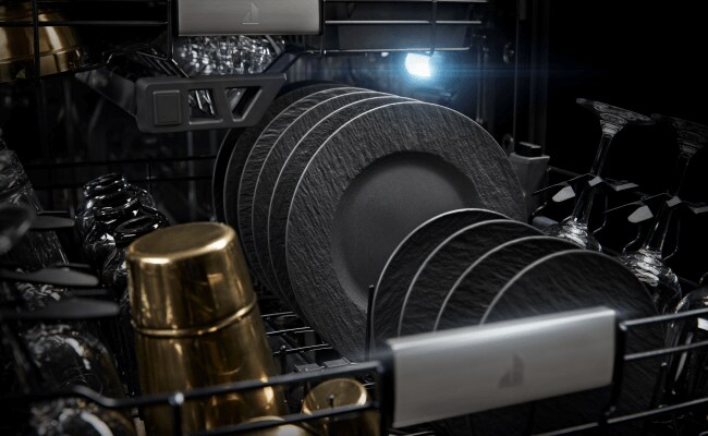 Plates and dishware inside a JennAir Dishwasher.  Plates and dishware inside a JennAir Dishwasher.