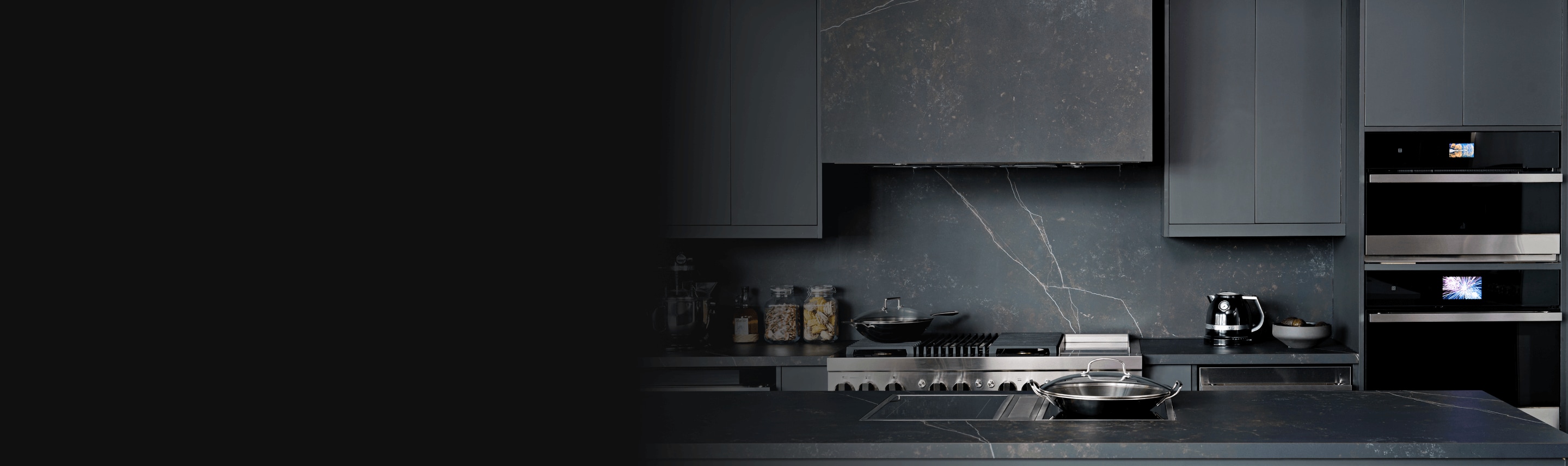 A modern, sleek appliances with a JennAir appliance suite.