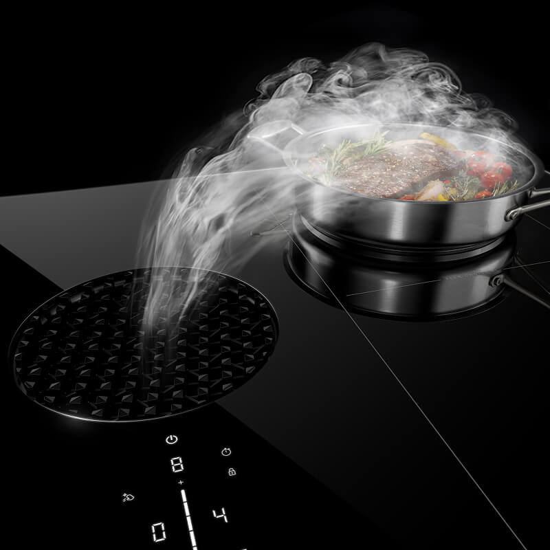 A downdraft induction cooktop ventilating smoke from a pan.