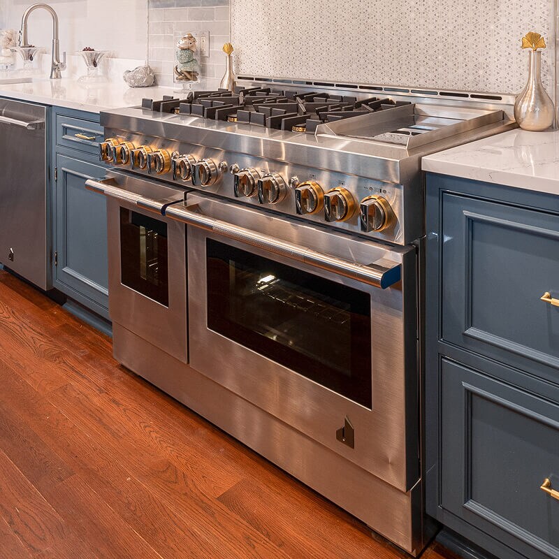 A professional-style slide-in range in a luxury kitchen.