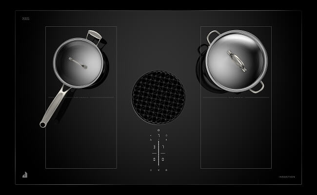 A downdraft induction cooktop with cookware.
