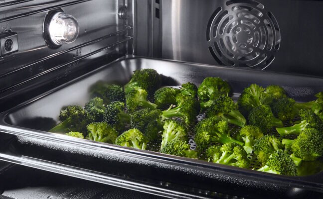 Broccoli cooking in a convection oven