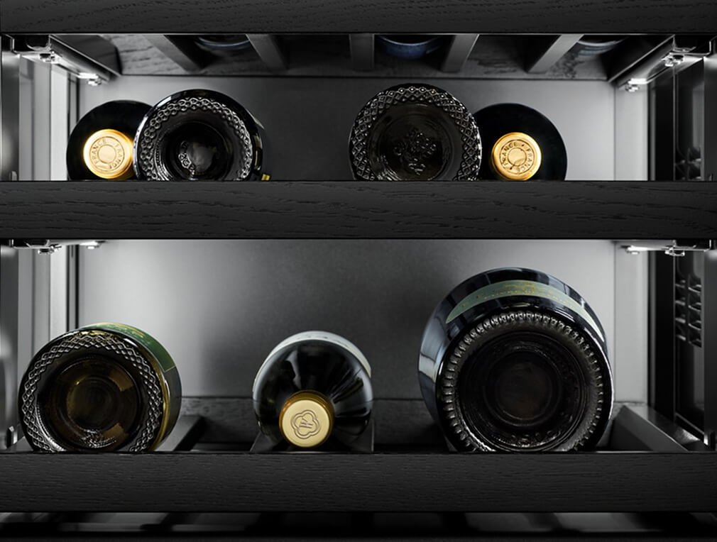 Wine bottles stored in a built-in wine refrigerator