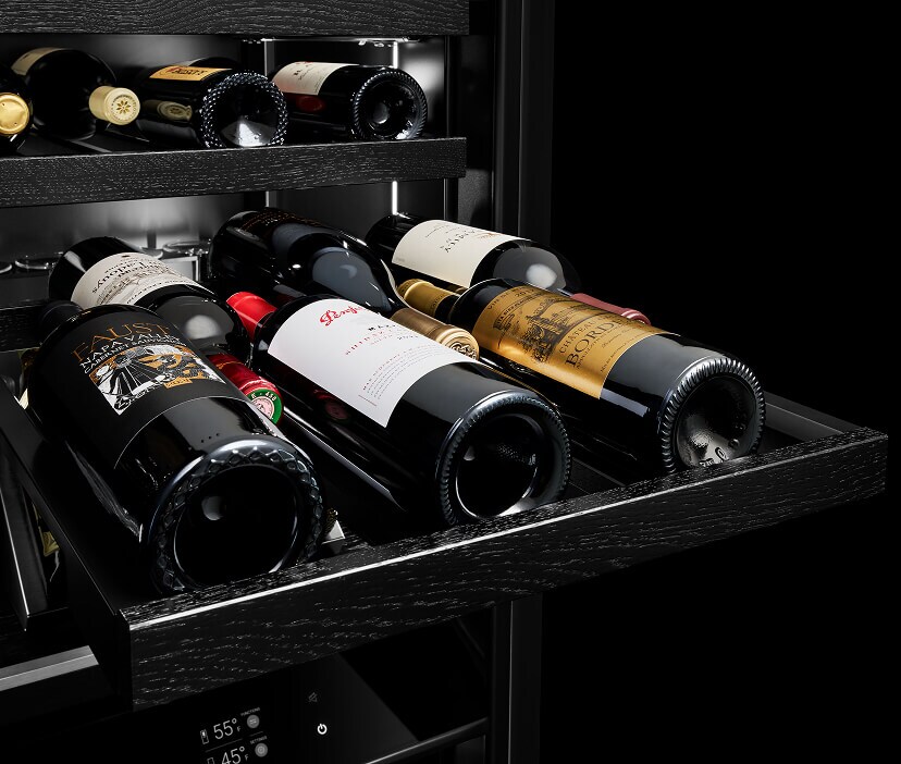 Interior of a JennAir® Undercounter Wine Refrigerator filled with wine bottles