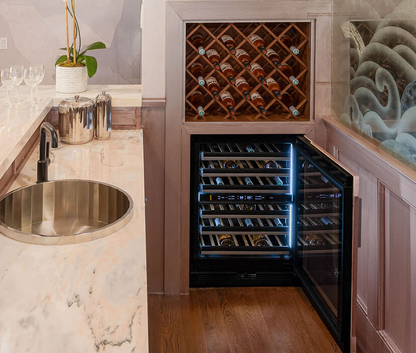 An elegant built-in bar with a JennAir® Wine Cellar.