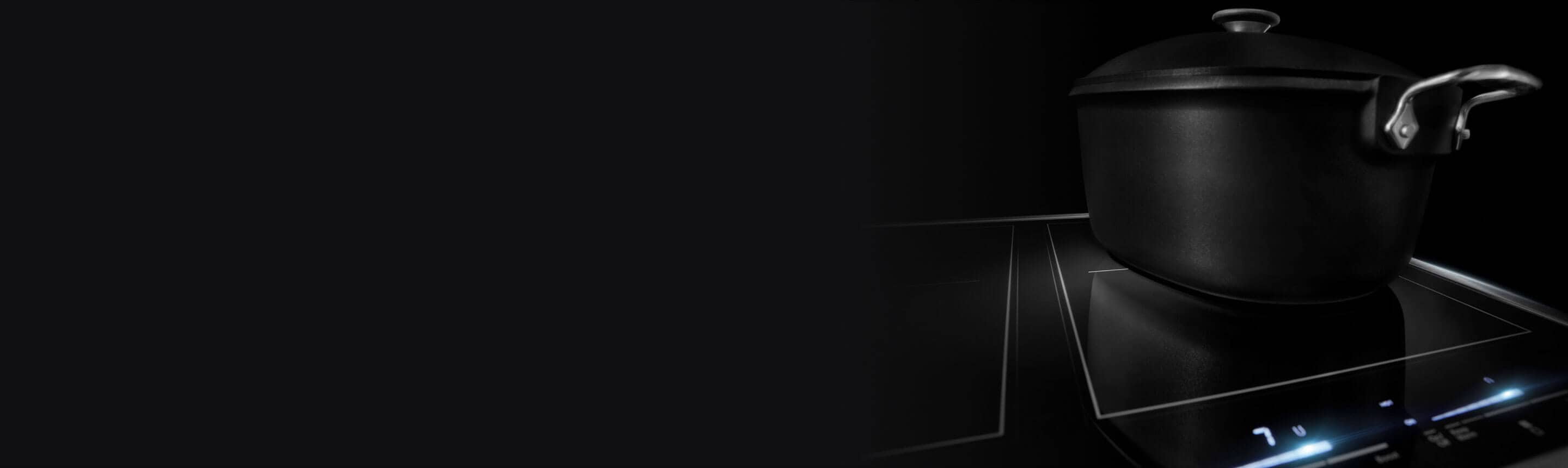 Black pot on an induction cooktop