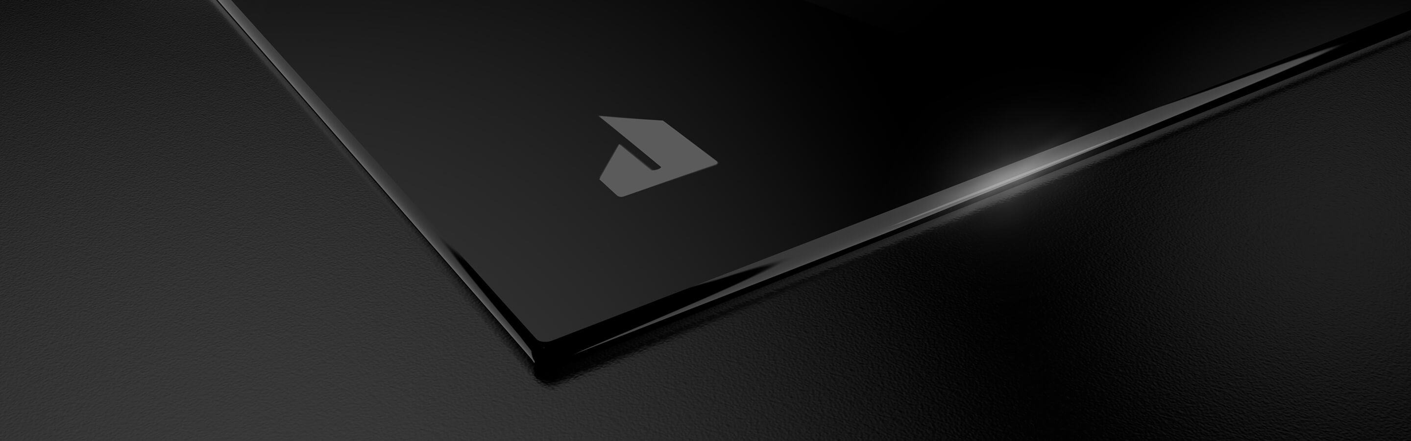 The JennAir brand badge on the JennAir® Induction Cooktop with Temperature Controlled Cooking.