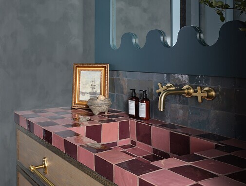 A bathroom with whimsical pink tile A bathroom with whimsical pink tile