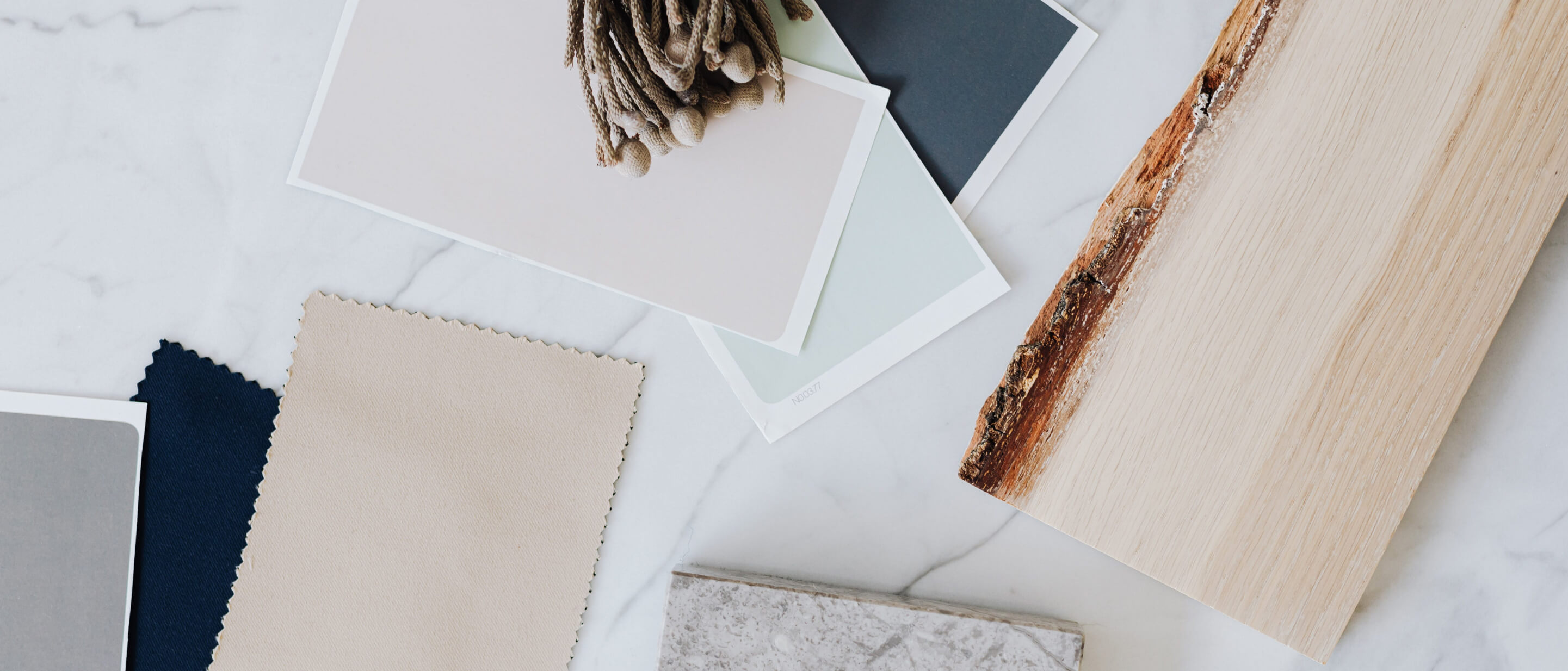 A series of swatches of soft colors, including beige, layered with wood, stone and other natural materials to form a pallet. A series of swatches of soft colors, including beige, layered with wood, stone and other natural materials to form a pallet.