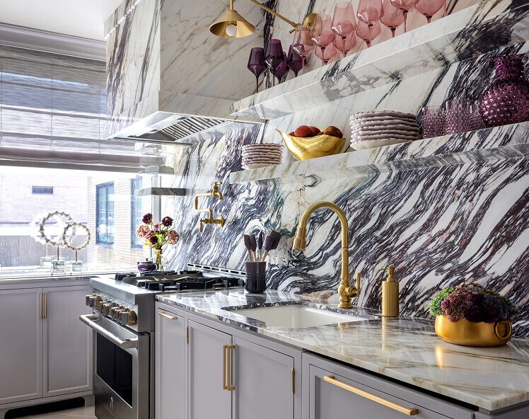A marble kitchen with JennAir® appliances, designed by Corey Damen Jenkins. A marble kitchen with JennAir® appliances, designed by Corey Damen Jenkins.