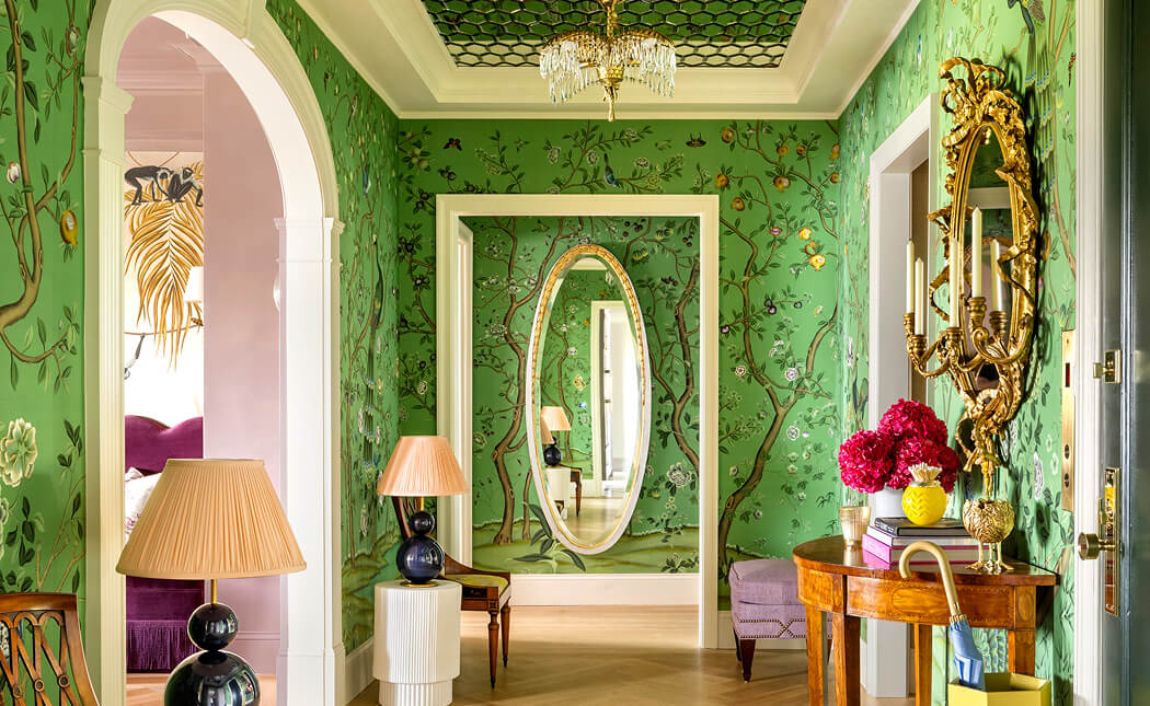 A green hallway with a floral wallpaper, designed by Corey Damen Jenkins. A green hallway with a floral wallpaper, designed by Corey Damen Jenkins.