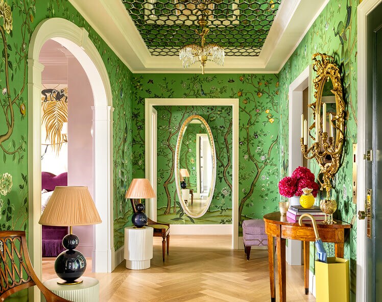 A green hallway with a floral wallpaper, designed by Corey Damen Jenkins. A green hallway with a floral wallpaper, designed by Corey Damen Jenkins.