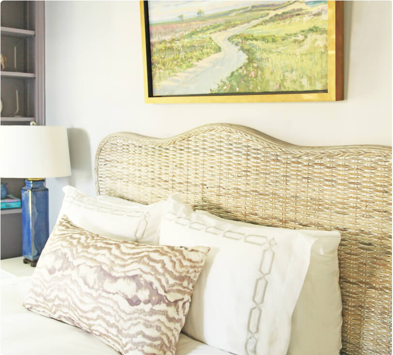 The headboard and bed of the lilac bedroom. 