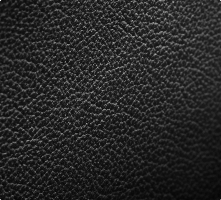 A close-up of the texture of a Carbon Cuts Leather Panel.
