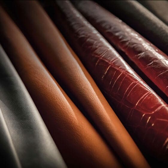 A close-up of all four original Cuts Leather designs, arranged next to one another.