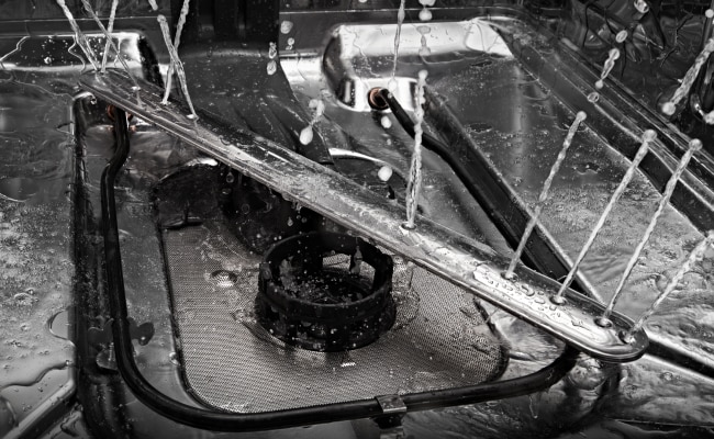 The water arm inside a JennAir Dishwasher. 