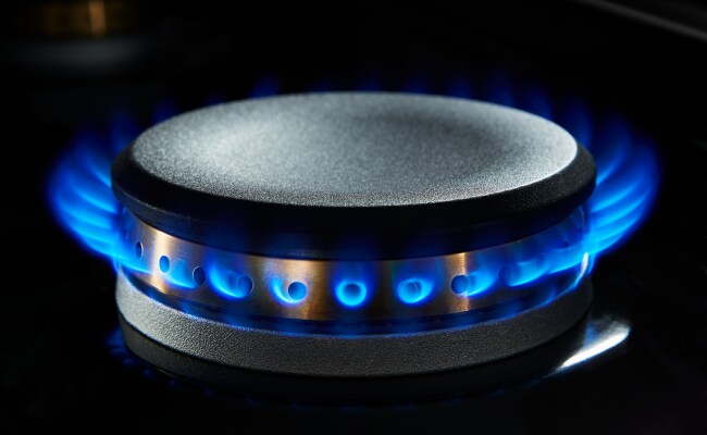 A lit gas burner. A lit gas burner.
