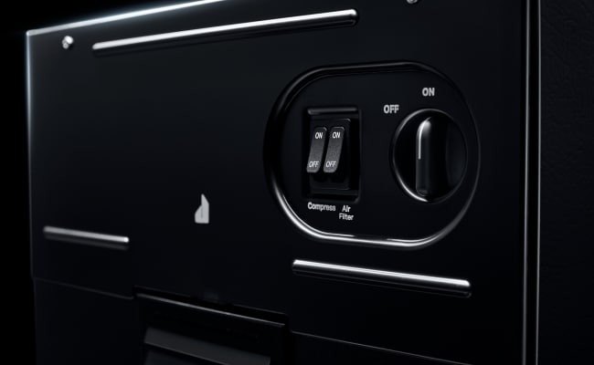 The controls on a JennAir Trash Compactor. 