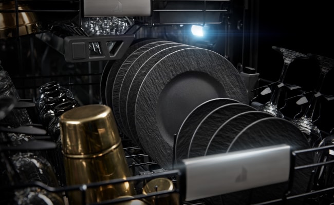 Plates and dishware inside a JennAir Dishwasher. 