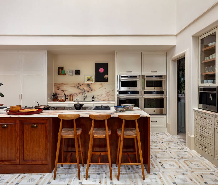 A modern kitchen with custom induction cooktops and two wall ovens