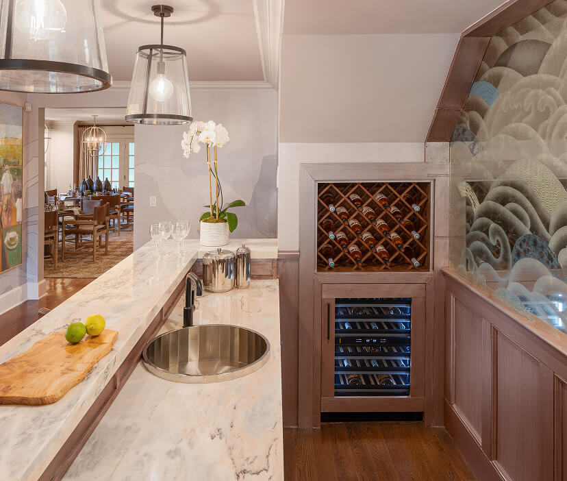 A luxury built-in coffee bar and beverage station in an upscale open kitchen