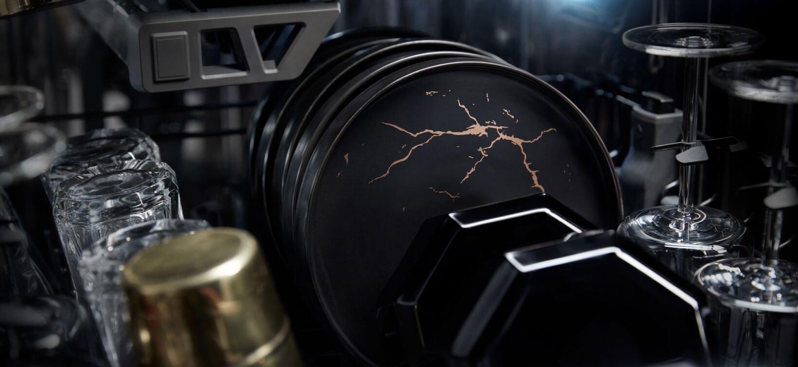 High-end dishes and wine glasses in a JennAir Dishwasher.  High-end dishes and wine glasses in a JennAir Dishwasher.