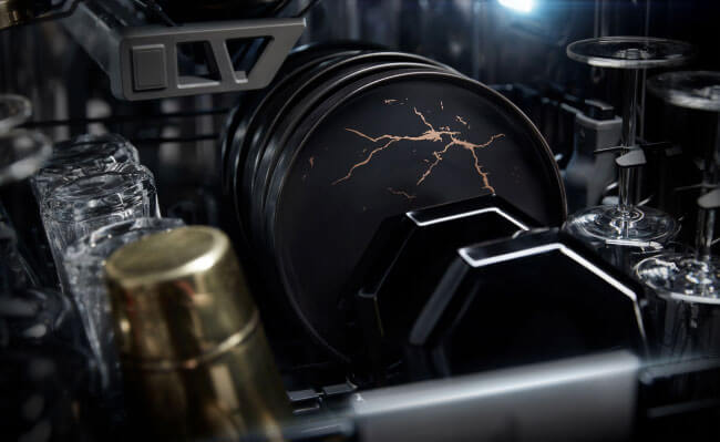 High-end dishes and wine glasses in a JennAir Dishwasher.  High-end dishes and wine glasses in a JennAir Dishwasher.