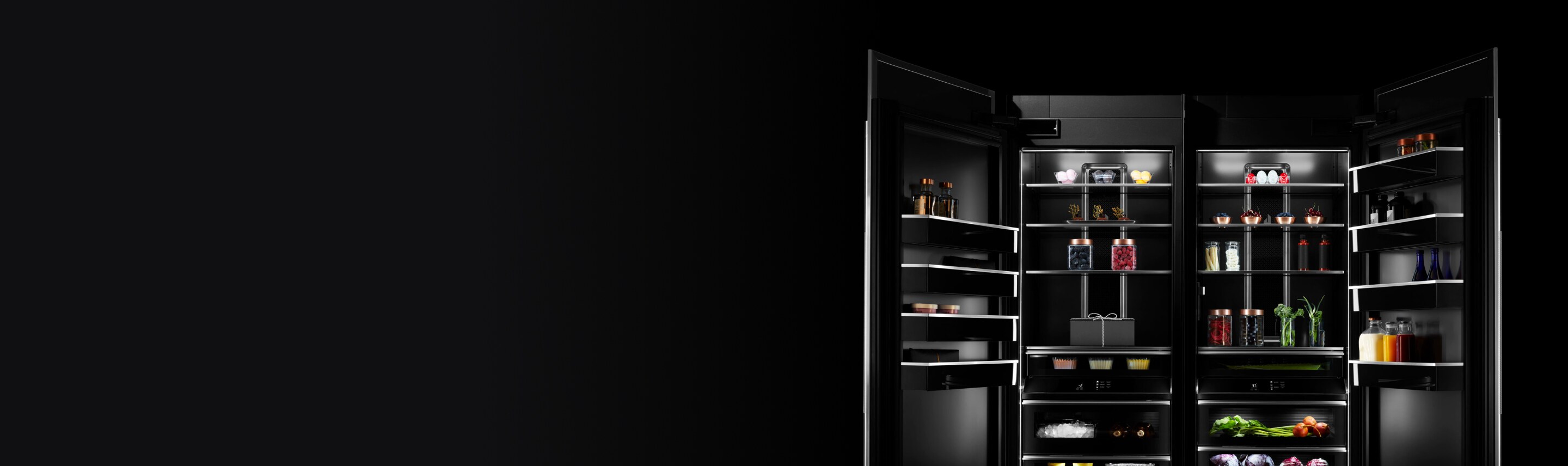 Two open JennAir columns stocked with luxurious ingredients and fine foods.