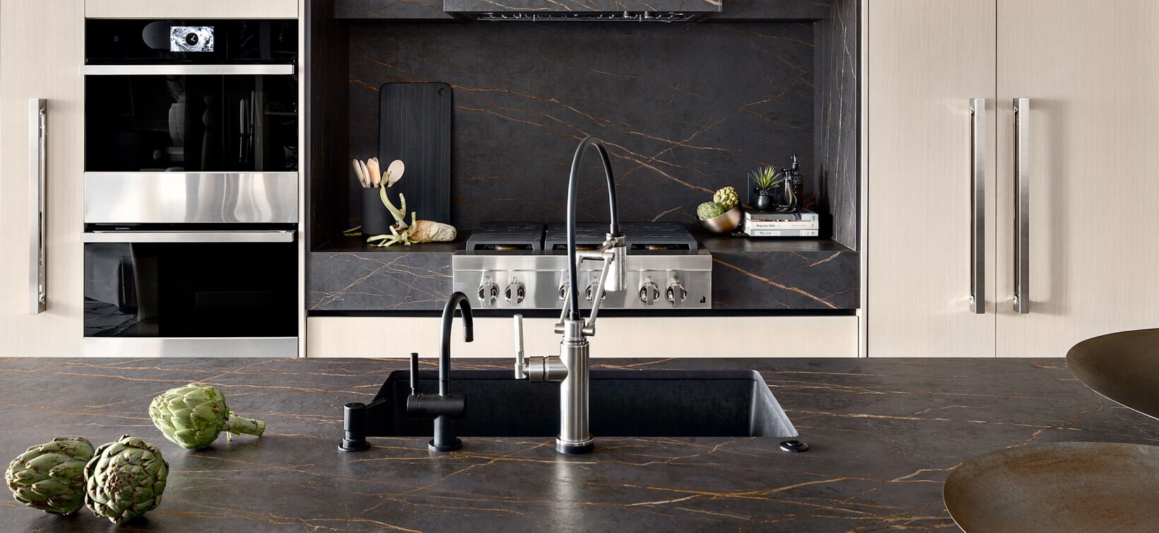 A modern kitchen filled with a suite of JennAir® appliances.