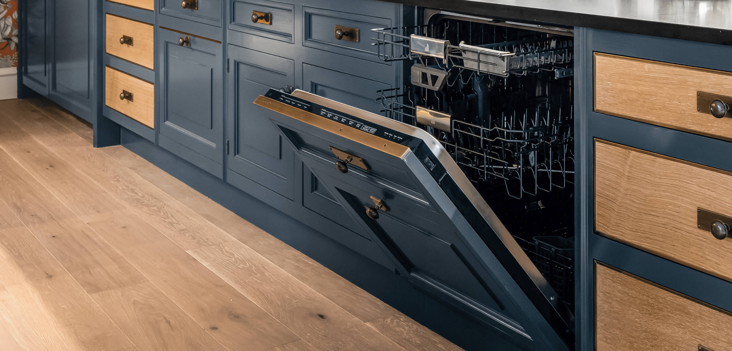 A luxury kitchen with a JennAir® quiet dishwasher integrated into cabinetry.