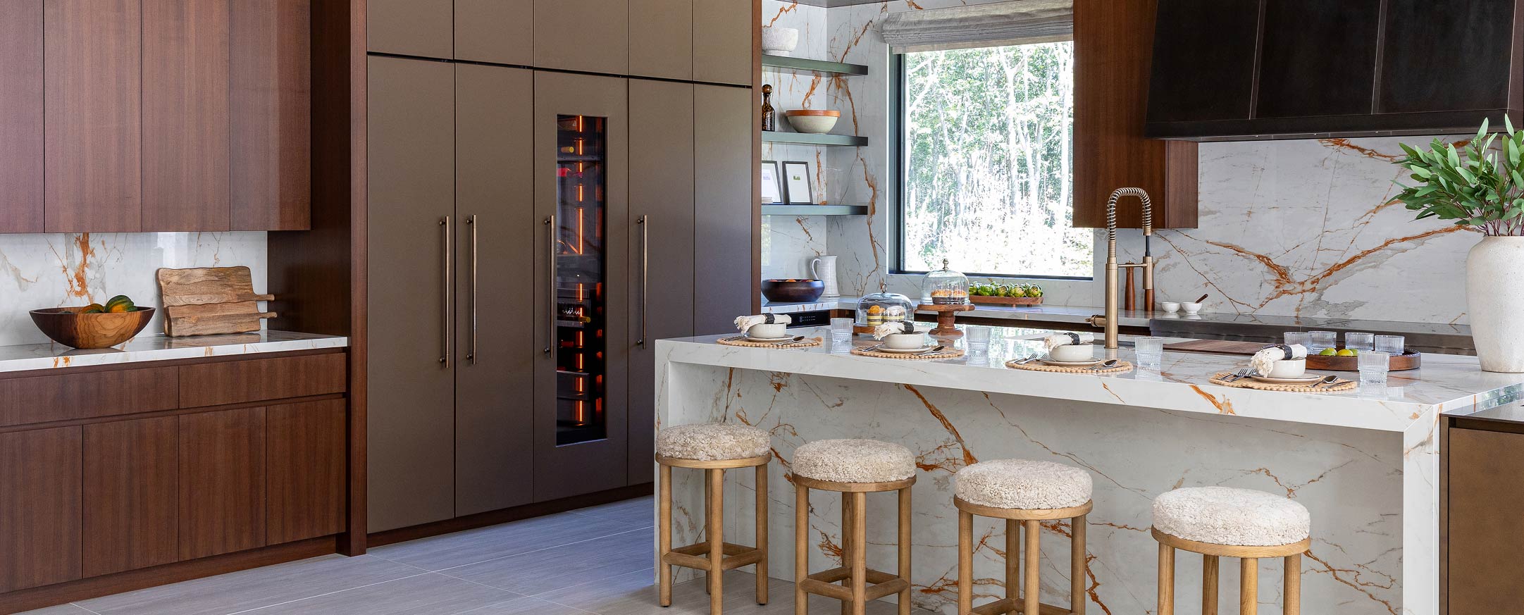 A bright kitchen with hidden appliances and cabinets