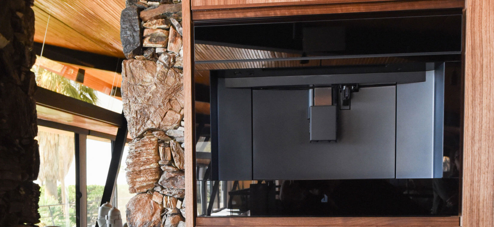 A JennAir Built-In Coffee Machine installed in a rustic, wooden home.  A JennAir Built-In Coffee Machine installed in a rustic, wooden home.