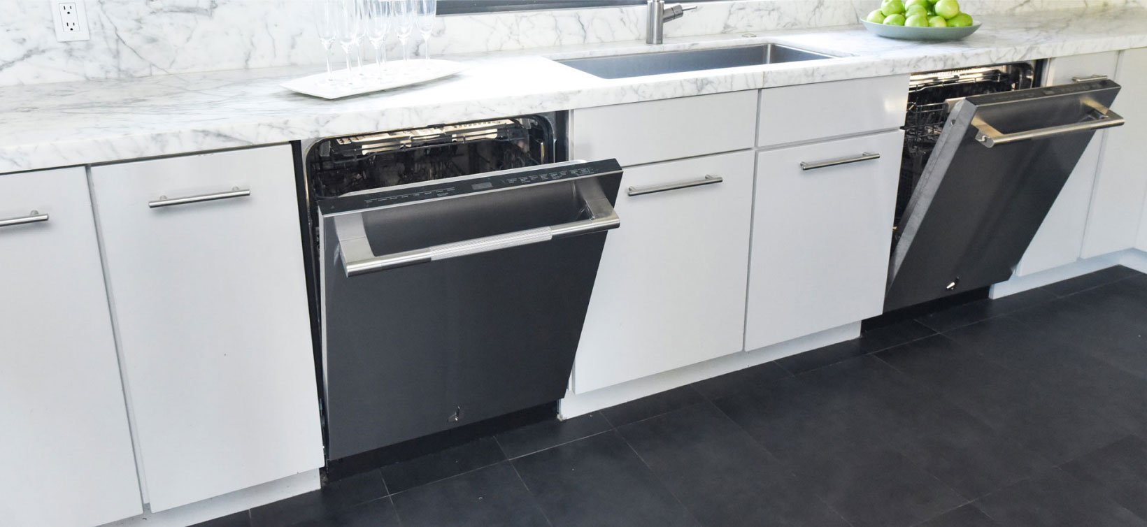 Two open JennAir Dishwashers in a bright white kitchen. 