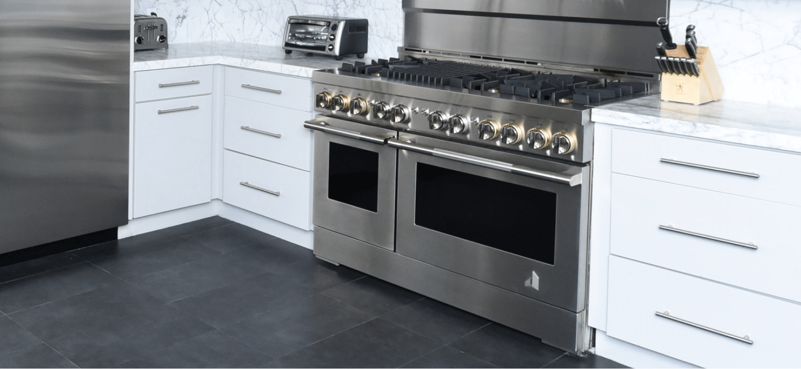 A JennAir Range in a modern white kitchen. A JennAir Range in a modern white kitchen.