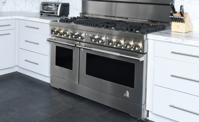 A JennAir Range in a modern white kitchen. A JennAir Range in a modern white kitchen.