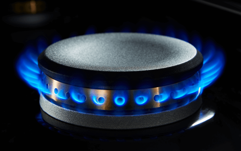 A lit gas burner. A lit gas burner.