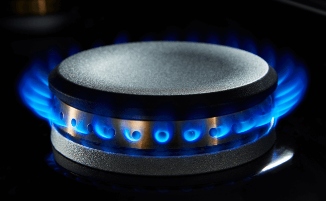 A lit gas burner. A lit gas burner.