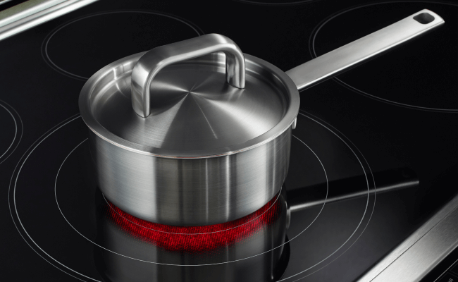 Cookware on an electric element.  Cookware on an electric element.