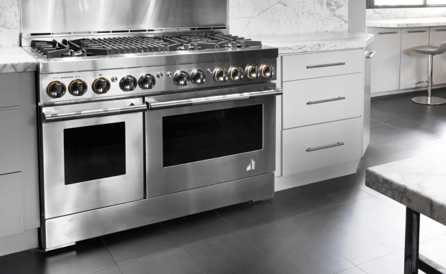A JennAir Range in the RISE™ Design Expression in a bright white kitchen.  A JennAir Range in the RISE™ Design Expression in a bright white kitchen.