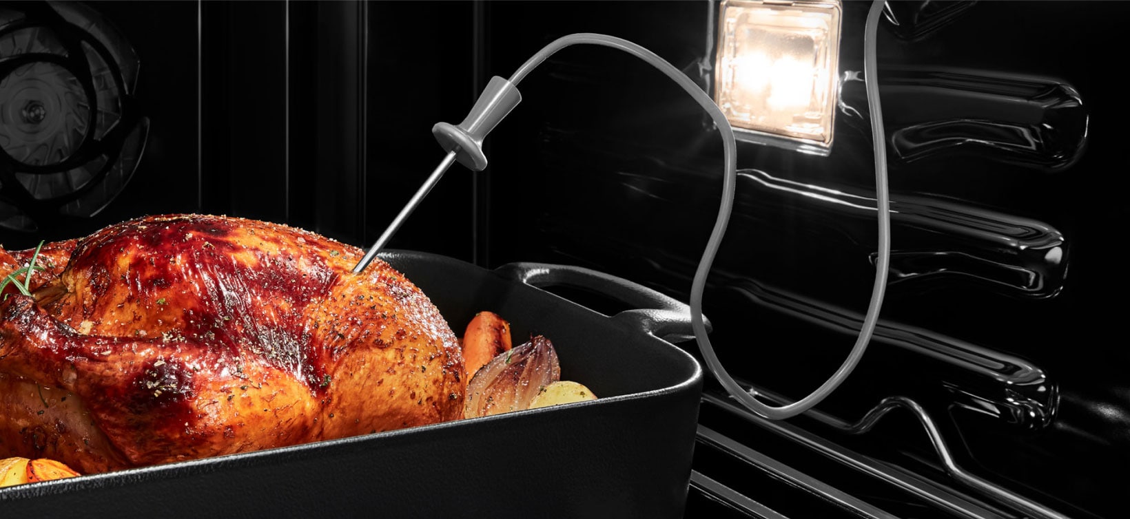 The Connected Temperature Probe placed in a roasting turkey withinin a JennAir Wall Oven. 